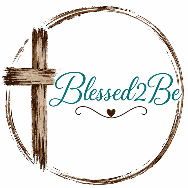 A circular graphic with a brown painted cross on the left, a large textured brown circle border, and the words 'Blessed2Be' in teal script with a small brown heart and flourish below, all on a white background.